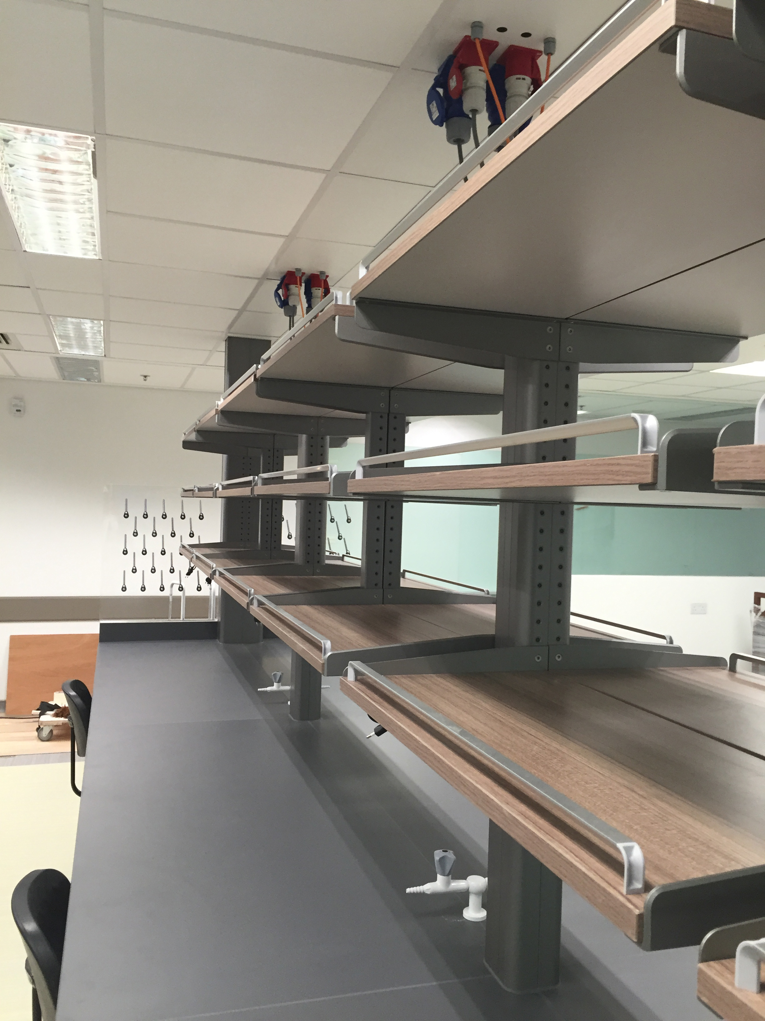 A closeup view of high-capacity heavy load mounting shelves in the laboratory furniture system
